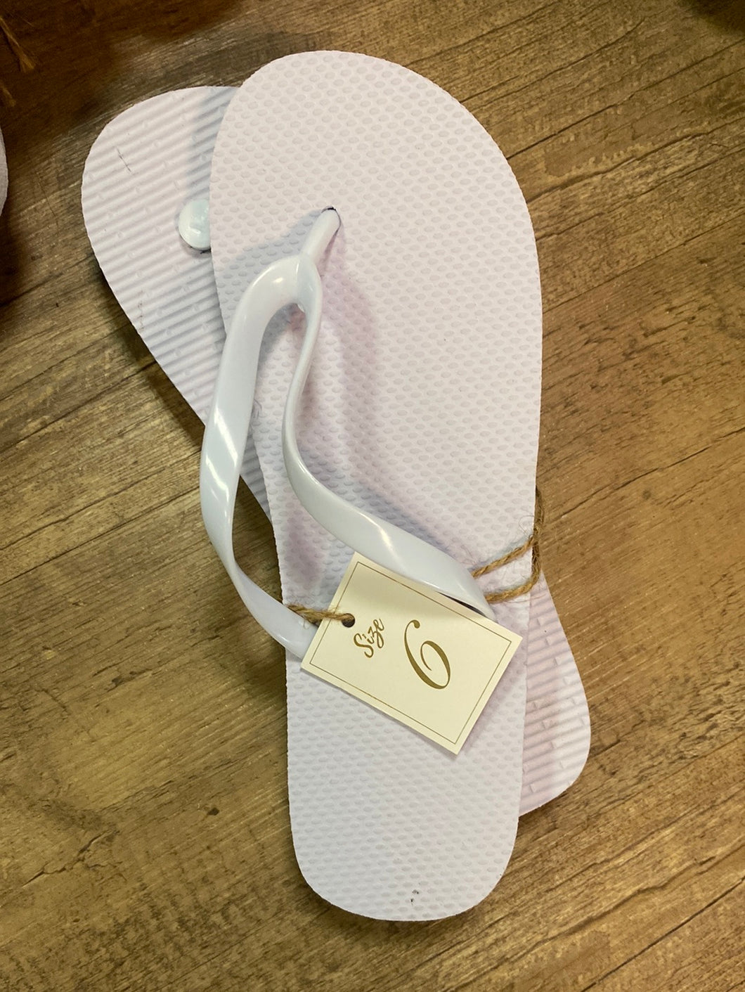 TRAN100-E White Flip Flops. Size 6